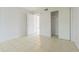 Bright bedroom with tile floors and a large closet at 190 Pompano Se Dr # A, St Petersburg, FL 33705