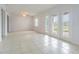 Bright living room with tile floors and access to a patio at 190 Pompano Se Dr # A, St Petersburg, FL 33705