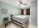 Spacious bedroom with a king-size bed and ceiling fan at 250 Rosery Nw Rd # 260, Largo, FL 33770