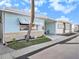 Side view of a light blue house with palm tree at 250 Rosery Nw Rd # 260, Largo, FL 33770