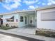 Exterior of light blue house with carport at 250 Rosery Nw Rd # 260, Largo, FL 33770