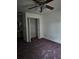 Bedroom with closet and ceiling fan at 39132 County Road 54 # 2216, Zephyrhills, FL 33542