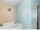 Bathroom features a soaking tub with clean, neutral finishes and calming color palette at 19245 Wood Sage Dr, Tampa, FL 33647