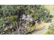 Aerial view of a house on a wooded lot at 1944 Sparkman Rd, Plant City, FL 33566