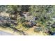 Aerial view of a house on a wooded lot at 1944 Sparkman Rd, Plant City, FL 33566