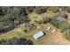 Aerial view showing home, shed, and boat on property at 1944 Sparkman Rd, Plant City, FL 33566