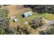 Aerial view of a home on a spacious lot with a shed and boat at 1944 Sparkman Rd, Plant City, FL 33566