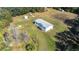 Aerial view of a home and lot with outbuildings at 1944 Sparkman Rd, Plant City, FL 33566