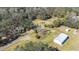 Aerial view showing two houses and outbuildings on a large lot at 1944 Sparkman Rd, Plant City, FL 33566