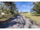 Gravel driveway through a wooded area at 1944 Sparkman Rd, Plant City, FL 33566