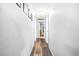 Bright hallway with wood-look flooring and access to other rooms at 1944 Sparkman Rd, Plant City, FL 33566