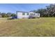 White mobile home with deck and yard at 1944 Sparkman Rd, Plant City, FL 33566