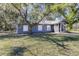 Gray house with a screened porch and yard at 1944 Sparkman Rd, Plant City, FL 33566