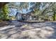 Gray house with a deck and large trees at 1944 Sparkman Rd, Plant City, FL 33566