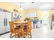 Cozy kitchen with wood cabinetry, a round table, and four chairs at 1944 Sparkman Rd, Plant City, FL 33566