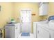 Laundry room with washer, dryer, and exterior access at 1944 Sparkman Rd, Plant City, FL 33566