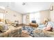 Bright living room with hardwood floors, comfy sofas, and a decorative rug at 1944 Sparkman Rd, Plant City, FL 33566