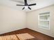 Bright bedroom with wood floors and ceiling fan at 4512 Preston Woods Dr, Valrico, FL 33596