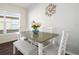 Dining area with gray table and white chairs at 4512 Preston Woods Dr, Valrico, FL 33596