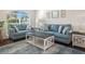 Living room with light blue sofas and a coffee table at 4512 Preston Woods Dr, Valrico, FL 33596