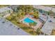Community pool and surrounding landscape at 1799 N Highland Ave # 26, Clearwater, FL 33755