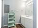 Well-lit bathroom with dual sinks and storage at 1799 N Highland Ave # 26, Clearwater, FL 33755