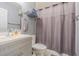 Clean bathroom with vanity, toilet, and shower/tub combo at 1799 N Highland Ave # 26, Clearwater, FL 33755