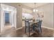 Bright condo dining area with four chairs and kitchen access at 1799 N Highland Ave # 26, Clearwater, FL 33755