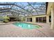 Resort-style pool and patio with screened enclosure and spacious deck at 6011 Hammock Hill Ave, Lithia, FL 33547