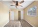 Well-lit bedroom with wood-look floors and ample closet space at 714 W Everina Cir, Brandon, FL 33510