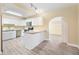 Modern kitchen with white shaker cabinets and granite countertops at 714 W Everina Cir, Brandon, FL 33510