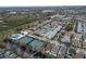 Aerial view of community, tennis courts, pool, and canal at 9713 Royce Dr, Tampa, FL 33626