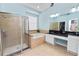 Large bathroom with double vanity, soaking tub, and separate shower at 9713 Royce Dr, Tampa, FL 33626