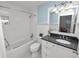 Clean bathroom with white subway tiles and granite vanity at 9713 Royce Dr, Tampa, FL 33626