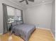 Bright bedroom with hardwood floors, ceiling fan and large windows at 9713 Royce Dr, Tampa, FL 33626