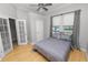 Spacious bedroom with hardwood floors and ceiling fan at 9713 Royce Dr, Tampa, FL 33626