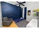 bedroom with a space-themed wall mural at 9713 Royce Dr, Tampa, FL 33626