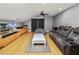 Bonus room with large screen TV, comfy seating and hardwood floors at 9713 Royce Dr, Tampa, FL 33626