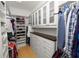 Spacious walk-in closet, built-in shelving, and drawers at 9713 Royce Dr, Tampa, FL 33626