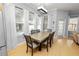 Bright dining room with hardwood floors and a large table at 9713 Royce Dr, Tampa, FL 33626