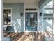 Front entrance with a blue door, sidelights and lanterns at 9713 Royce Dr, Tampa, FL 33626