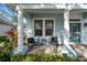 Front porch with rocking chairs and a view of the front yard at 9713 Royce Dr, Tampa, FL 33626