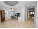 Bright home office with hardwood floors, view into living room, and large windows at 9713 Royce Dr, Tampa, FL 33626