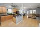 Modern kitchen with light wood cabinets, granite counters and stainless steel appliances at 9713 Royce Dr, Tampa, FL 33626