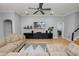 Spacious living room, hardwood floors, large sectional sofa at 9713 Royce Dr, Tampa, FL 33626