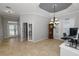 Bright living room with tile floors and coffered ceiling at 9713 Royce Dr, Tampa, FL 33626