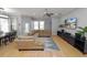 Spacious living room, hardwood floors, large sectional sofa at 9713 Royce Dr, Tampa, FL 33626