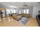 Spacious living room, hardwood floors, large sectional sofa at 9713 Royce Dr, Tampa, FL 33626