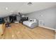 Spacious main bedroom with sitting area and hardwood floors at 9713 Royce Dr, Tampa, FL 33626