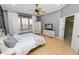 Main bedroom with hardwood floors and ensuite bathroom at 9713 Royce Dr, Tampa, FL 33626